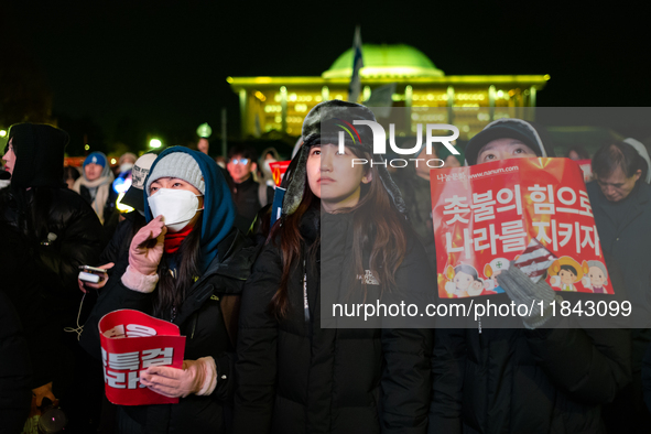 Supporters of President Yoon Suk-yeol's impeachment shed tears after the motion is rejected in the National Assembly. On December 7, 2024, i...