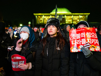 Supporters of President Yoon Suk-yeol's impeachment shed tears after the motion is rejected in the National Assembly. On December 7, 2024, i...