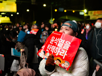 Supporters of President Yoon Suk-yeol's impeachment shed tears after the motion is rejected in the National Assembly. On December 7, 2024, i...