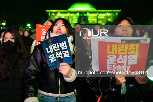 Supporters of President Yoon Suk-yeol's impeachment shed tears after the motion is rejected in the National Assembly. On December 7, 2024, i...