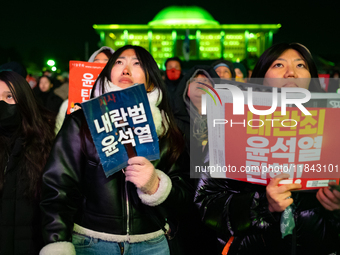 Supporters of President Yoon Suk-yeol's impeachment shed tears after the motion is rejected in the National Assembly. On December 7, 2024, i...