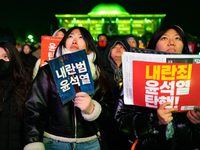 Supporters of President Yoon Suk-yeol's impeachment shed tears after the motion is rejected in the National Assembly. On December 7, 2024, i...