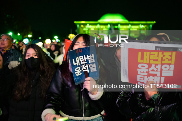 Supporters of President Yoon Suk-yeol's impeachment shed tears after the motion is rejected in the National Assembly. On December 7, 2024, i...