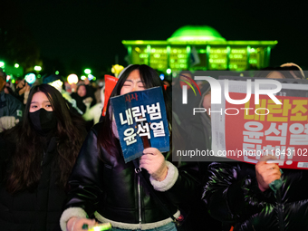 Supporters of President Yoon Suk-yeol's impeachment shed tears after the motion is rejected in the National Assembly. On December 7, 2024, i...