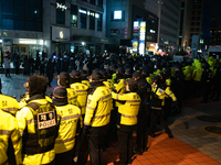 The police set up barricades and block access in front of the People Power Party's central headquarters. Nearly one million citizens gather...