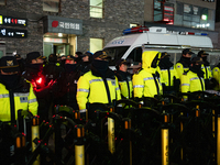 The police set up barricades and block access in front of the People Power Party's central headquarters. Nearly one million citizens gather...