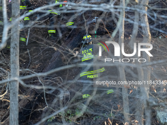 The Washington DC Fire Department battles a brush fire in Rock Creek Park, a National Park in Washington DC, on December 7, 2024. The fire b...