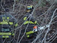 The Washington DC Fire Department battles a brush fire in Rock Creek Park, a National Park in Washington DC, on December 7, 2024. The fire b...