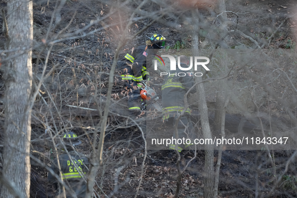 The Washington DC Fire Department battles a brush fire in Rock Creek Park, a National Park in Washington DC, on December 7, 2024. The fire b...