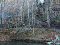 The Washington DC Fire Department battles a brush fire in Rock Creek Park, a National Park in Washington DC, on December 7, 2024. The fire b...