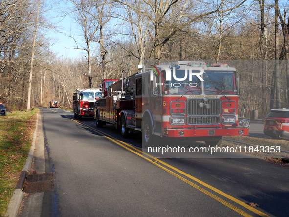 The Washington DC Fire Department battles a brush fire in Rock Creek Park, a National Park in Washington DC, on December 7, 2024. The fire b...