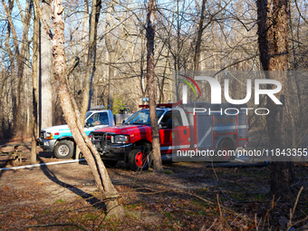 The Washington DC Fire Department battles a brush fire in Rock Creek Park, a National Park in Washington DC, on December 7, 2024. The fire b...