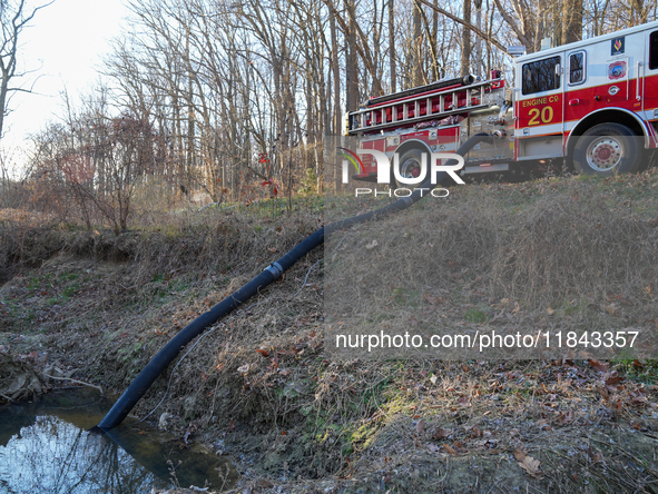 The Washington DC Fire Department battles a brush fire in Rock Creek Park, a National Park in Washington DC, on December 7, 2024. The fire b...