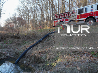 The Washington DC Fire Department battles a brush fire in Rock Creek Park, a National Park in Washington DC, on December 7, 2024. The fire b...