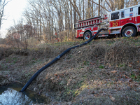 The Washington DC Fire Department battles a brush fire in Rock Creek Park, a National Park in Washington DC, on December 7, 2024. The fire b...