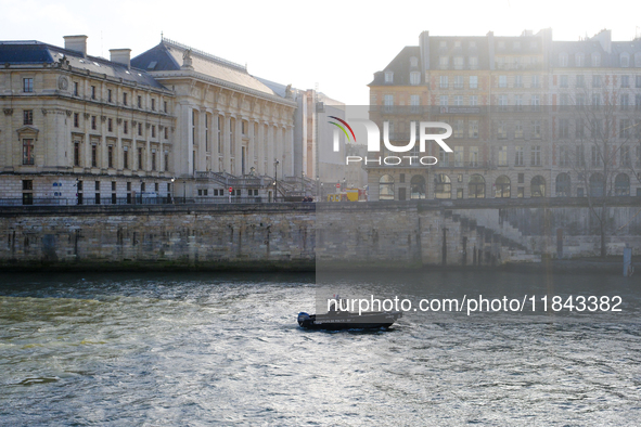 A police prefecture boat patrols the Seine around the Ile de la Cite, where Notre-Dame Cathedral is located. 