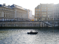 A police prefecture boat patrols the Seine around the Ile de la Cite, where Notre-Dame Cathedral is located. (