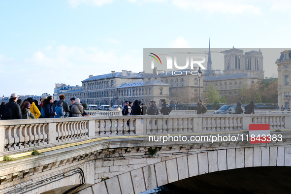 Police prevent pedestrians without accreditation from accessing the Ile de la Cite, where Notre-Dame Cathedral is located. 