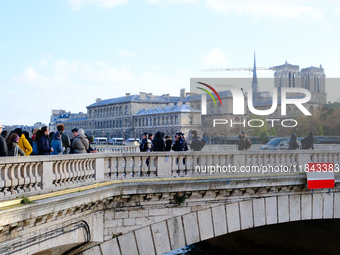 Police prevent pedestrians without accreditation from accessing the Ile de la Cite, where Notre-Dame Cathedral is located. (