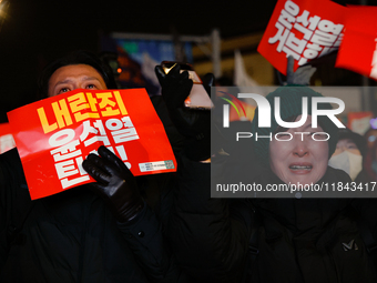 Citizens shed tears after the motion to impeach President Yoon Suk Yeol is rejected in the National Assembly. On December 7, 2024, nearly on...