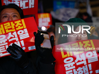 Citizens shed tears after the motion to impeach President Yoon Suk Yeol is rejected in the National Assembly. On December 7, 2024, nearly on...