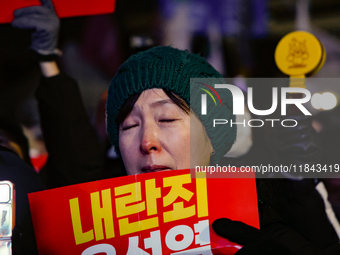 Citizens shed tears after the motion to impeach President Yoon Suk Yeol is rejected in the National Assembly. On December 7, 2024, nearly on...