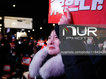 Citizens shed tears after the motion to impeach President Yoon Suk Yeol is rejected in the National Assembly. On December 7, 2024, nearly on...