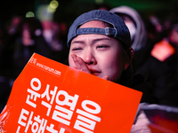 Citizens shed tears after the motion to impeach President Yoon Suk Yeol is rejected in the National Assembly. On December 7, 2024, nearly on...