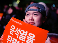 Citizens shed tears after the motion to impeach President Yoon Suk Yeol is rejected in the National Assembly. On December 7, 2024, nearly on...