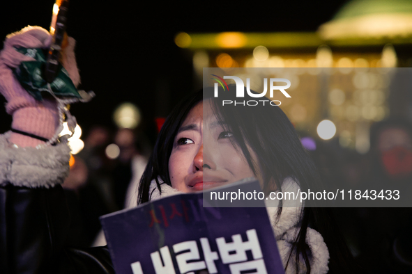 Citizens shed tears after the motion to impeach President Yoon Suk Yeol is rejected in the National Assembly. On December 7, 2024, nearly on...