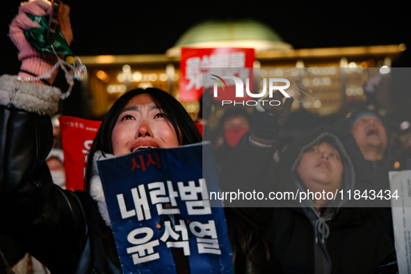 Citizens shed tears after the motion to impeach President Yoon Suk Yeol is rejected in the National Assembly. On December 7, 2024, nearly on...