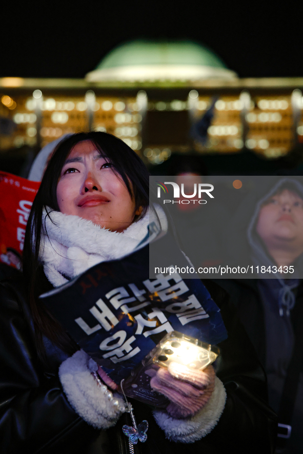 Citizens shed tears after the motion to impeach President Yoon Suk Yeol is rejected in the National Assembly. On December 7, 2024, nearly on...