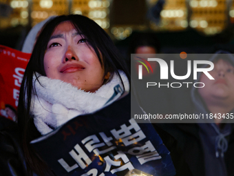 Citizens shed tears after the motion to impeach President Yoon Suk Yeol is rejected in the National Assembly. On December 7, 2024, nearly on...