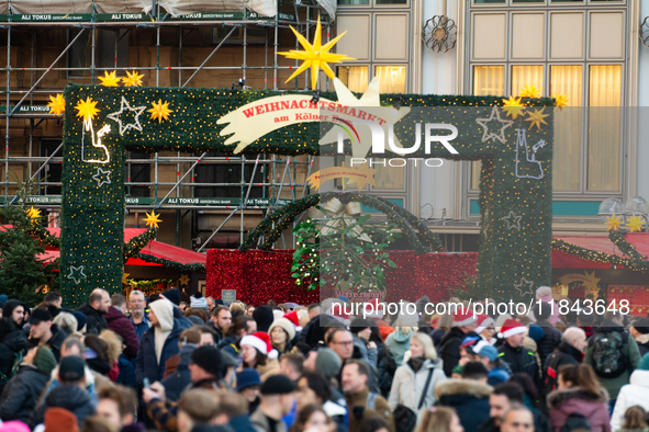 The entrance of the Cologne Dom Christmas Market in Cologne, Germany, on December 7, 2024, is completely packed with visitors. 