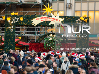 The entrance of the Cologne Dom Christmas Market in Cologne, Germany, on December 7, 2024, is completely packed with visitors. (