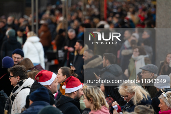 The entrance of the Cologne Dom Christmas Market in Cologne, Germany, on December 7, 2024, is completely packed with visitors. 