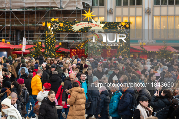 The entrance of the Cologne Dom Christmas Market in Cologne, Germany, on December 7, 2024, is completely packed with visitors. 