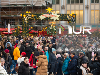 The entrance of the Cologne Dom Christmas Market in Cologne, Germany, on December 7, 2024, is completely packed with visitors. (