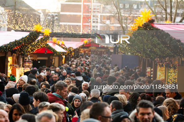 The Cologne Dom Christmas Market in Cologne, Germany, is completely packed with visitors on December 7, 2024. 