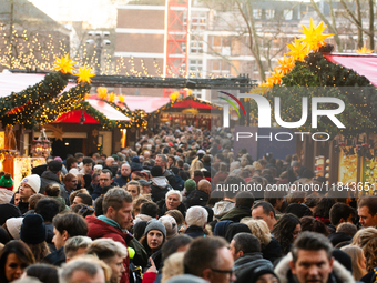 The Cologne Dom Christmas Market in Cologne, Germany, is completely packed with visitors on December 7, 2024. (