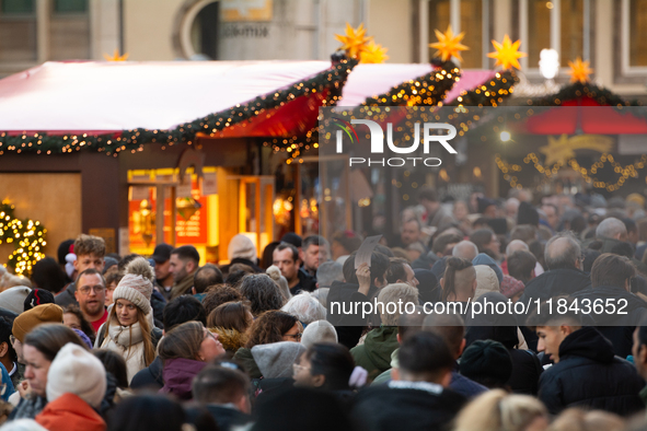 The Cologne Dom Christmas Market in Cologne, Germany, is completely packed with visitors on December 7, 2024. 