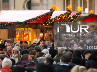 The Cologne Dom Christmas Market in Cologne, Germany, is completely packed with visitors on December 7, 2024. (