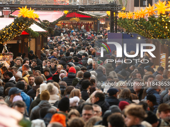 The Cologne Dom Christmas Market in Cologne, Germany, is completely packed with visitors on December 7, 2024. (