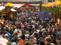 The Cologne Dom Christmas Market in Cologne, Germany, is completely packed with visitors on December 7, 2024. (