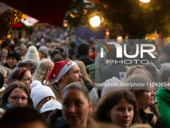 The Cologne Dom Christmas Market in Cologne, Germany, is completely packed with visitors on December 7, 2024. (