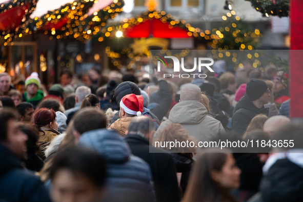 The Cologne Dom Christmas Market in Cologne, Germany, is completely packed with visitors on December 7, 2024. 