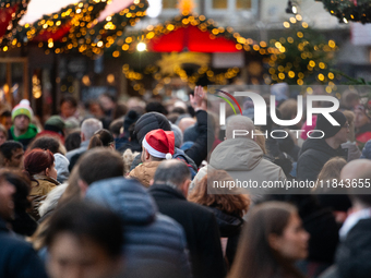 The Cologne Dom Christmas Market in Cologne, Germany, is completely packed with visitors on December 7, 2024. (