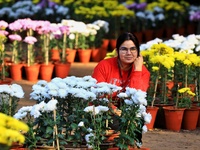 Visitors attend the 38th Chrysanthemum Flower Exhibition at Rajasthan University in Jaipur, Rajasthan, India, on December 7, 2024. (