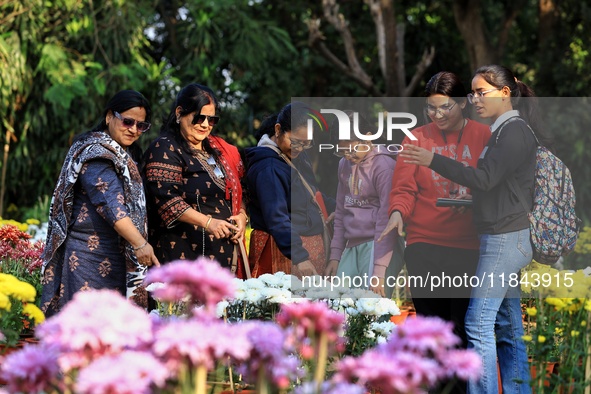 Visitors attend the 38th Chrysanthemum Flower Exhibition at Rajasthan University in Jaipur, Rajasthan, India, on December 7, 2024. 