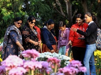 Visitors attend the 38th Chrysanthemum Flower Exhibition at Rajasthan University in Jaipur, Rajasthan, India, on December 7, 2024. (